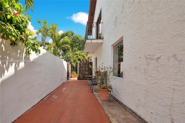 view of side of home featuring a patio area