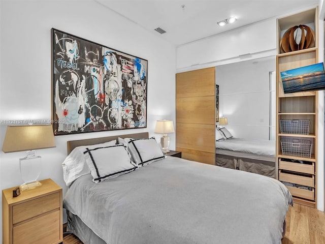 bedroom featuring light wood-type flooring