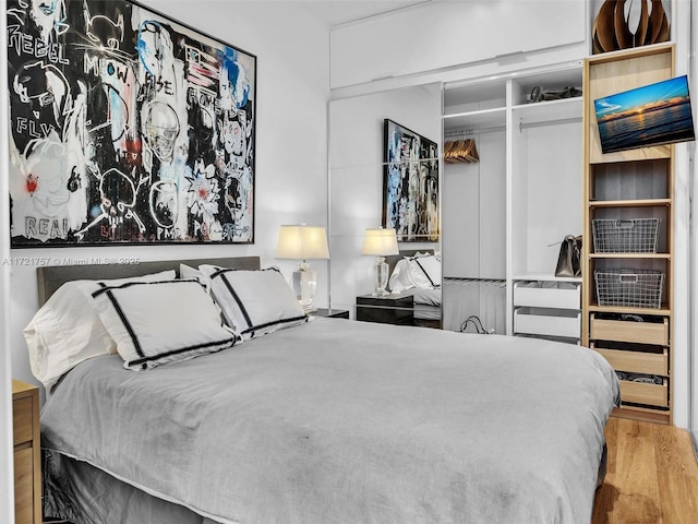 bedroom featuring hardwood / wood-style flooring and a closet