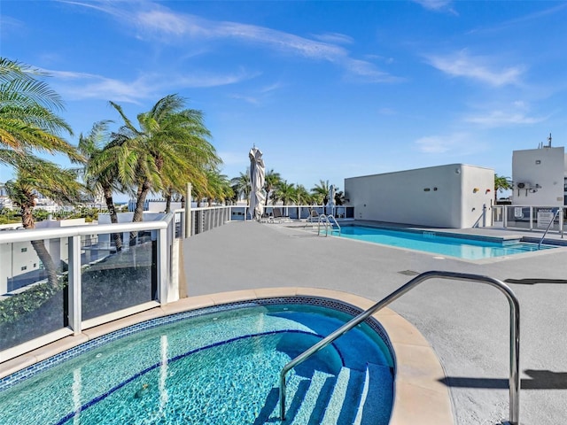 view of swimming pool with a patio