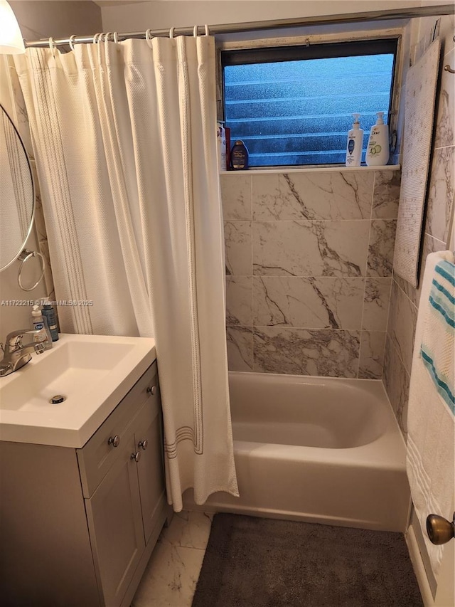 bathroom featuring vanity and shower / bath combo