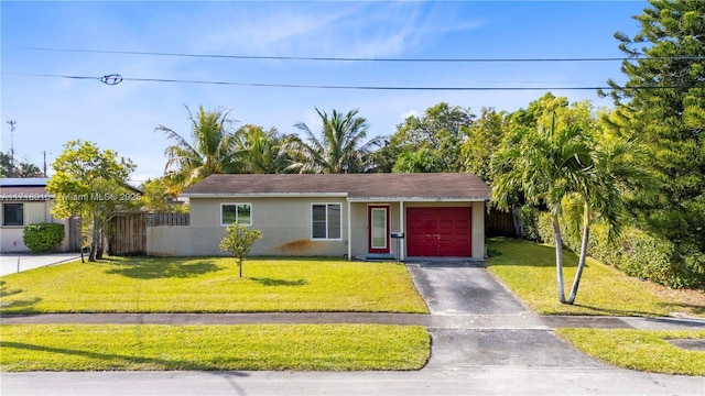 view of front of house featuring a front lawn and a garage