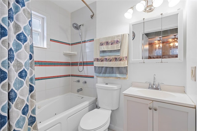 full bathroom featuring ceiling fan, shower / tub combo with curtain, vanity, and toilet