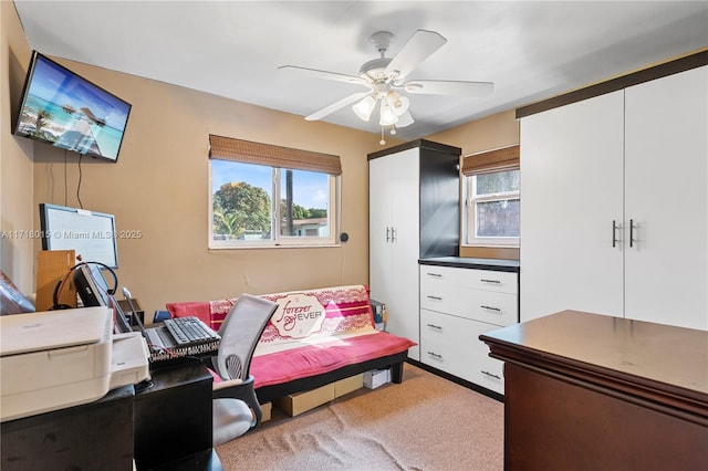 bedroom featuring ceiling fan and light colored carpet