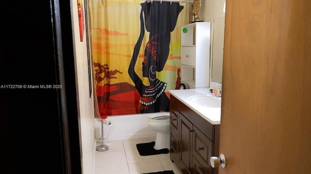 bathroom featuring tile patterned floors, toilet, vanity, and shower / bath combination with curtain