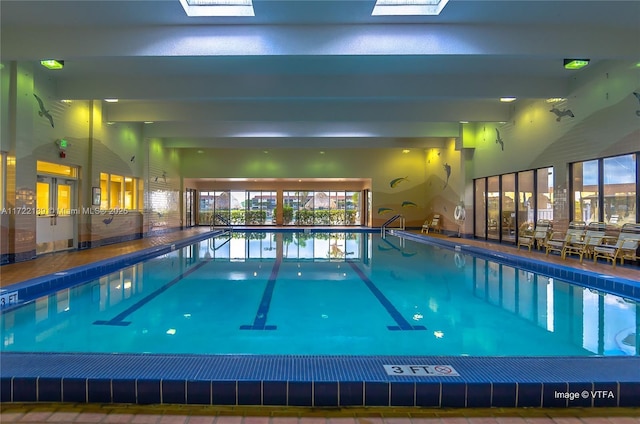 view of swimming pool with a skylight