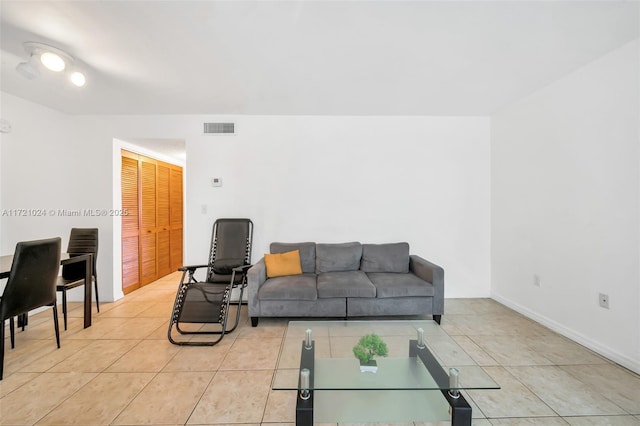 living room with light tile patterned floors