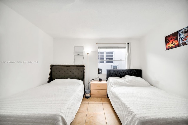 bedroom with light tile patterned floors