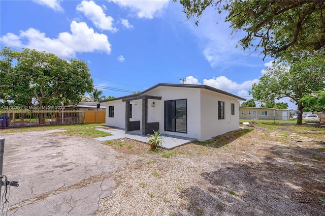 back of house with a patio