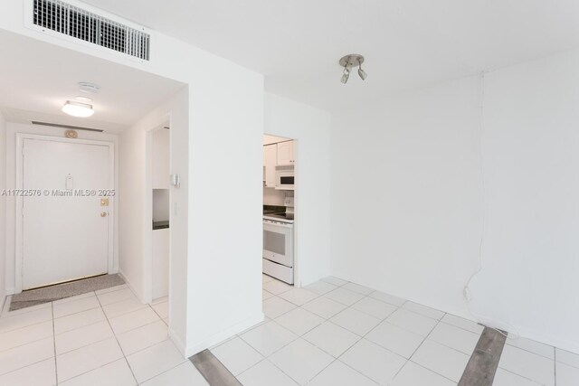1408 Brickell Bay Dr Unit 1116, Miami, FL 33131 - hall featuring light tile patterned flooring