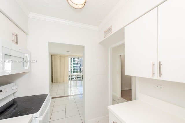 1408 Brickell Bay Dr Unit 1116, Miami, FL 33131 - kitchen with white appliances, crown molding, white cabinets, light countertops, and light tile patterned floors