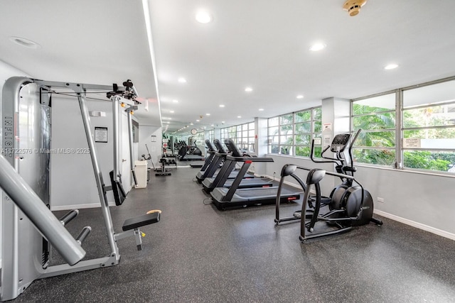 1408 Brickell Bay Dr Unit 1116, Miami, FL 33131 - exercise room with baseboards and recessed lighting