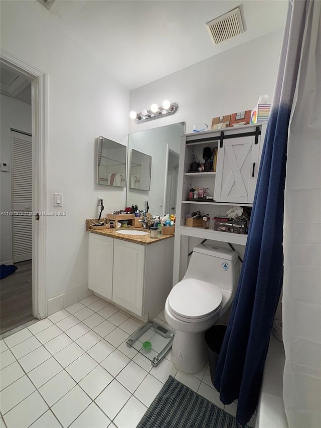 bathroom featuring toilet, tile patterned flooring, visible vents, and vanity