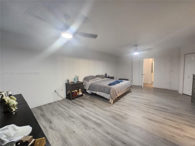 bedroom with ceiling fan and wood finished floors