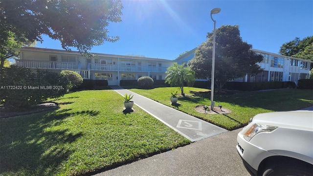 view of front of property with a front lawn