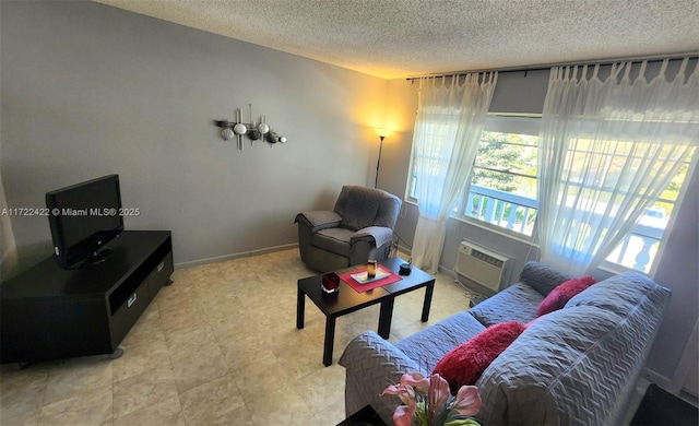 living room featuring a textured ceiling and a wall mounted AC