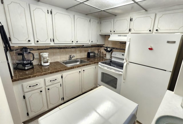 kitchen featuring white appliances, ventilation hood, white cabinetry, and sink