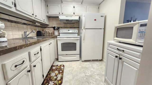 kitchen featuring white appliances, backsplash, white cabinets, sink, and light tile patterned flooring