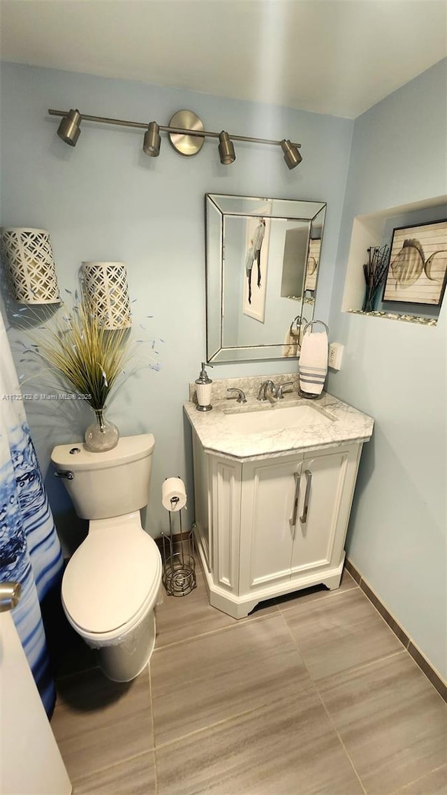 bathroom with vanity and toilet