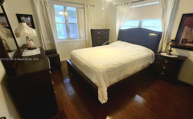 bedroom featuring dark hardwood / wood-style floors