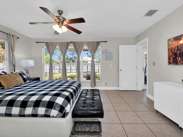 bedroom featuring access to outside, ceiling fan, and light tile patterned flooring