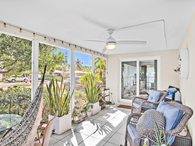 sunroom featuring ceiling fan