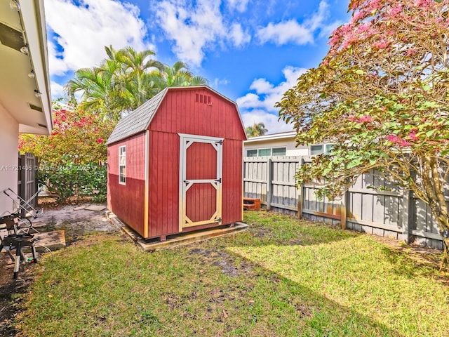 view of outbuilding with a yard