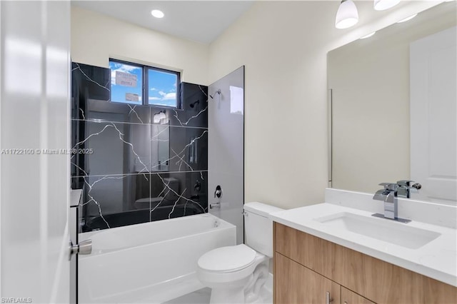 full bathroom featuring vanity, toilet, and tiled shower / bath combo