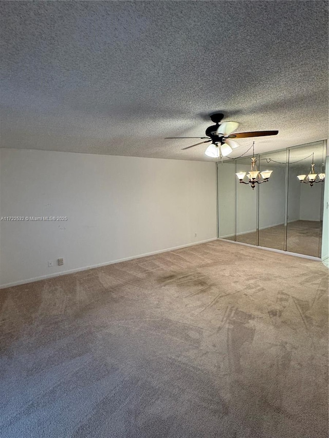 unfurnished bedroom with ceiling fan, a textured ceiling, and carpet flooring