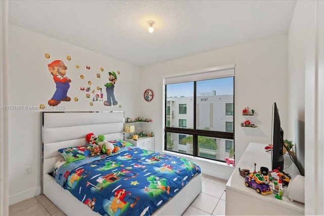 bedroom featuring light tile patterned flooring