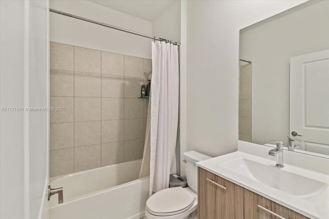 full bathroom with vanity, shower / bath combination with curtain, and toilet