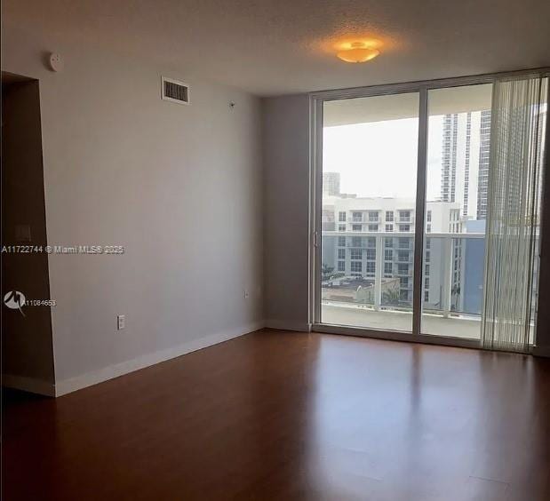 empty room featuring expansive windows