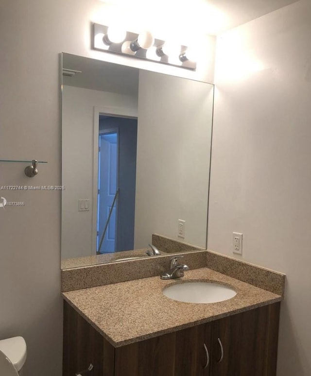 half bath with toilet and vanity