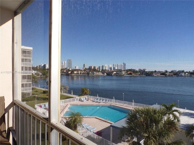 pool with a water view and a city view