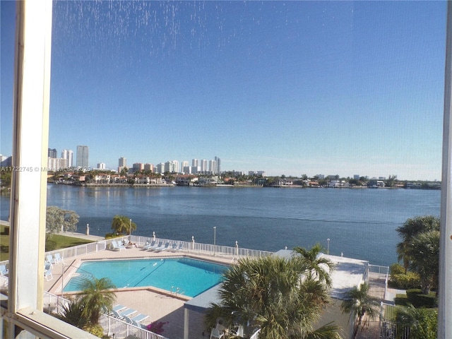 community pool with a city view and a water view