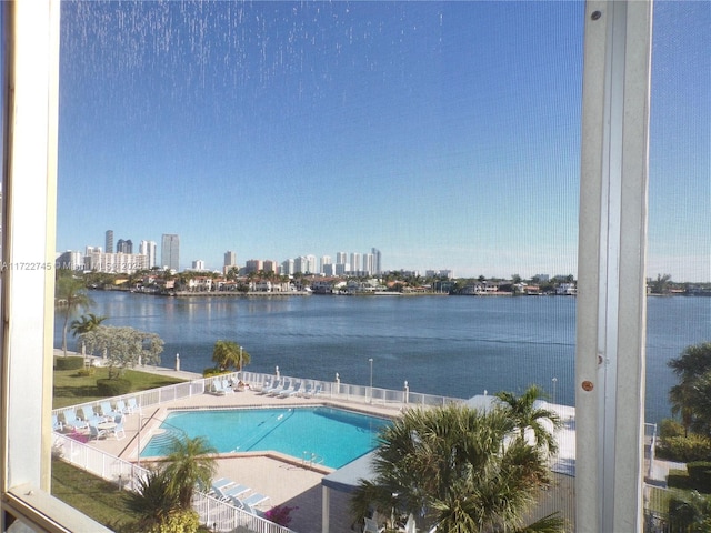 view of pool featuring a water view