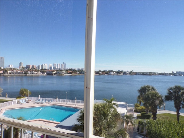 view of pool featuring a water view