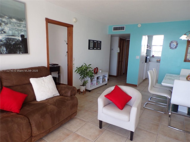 living room with light tile patterned floors