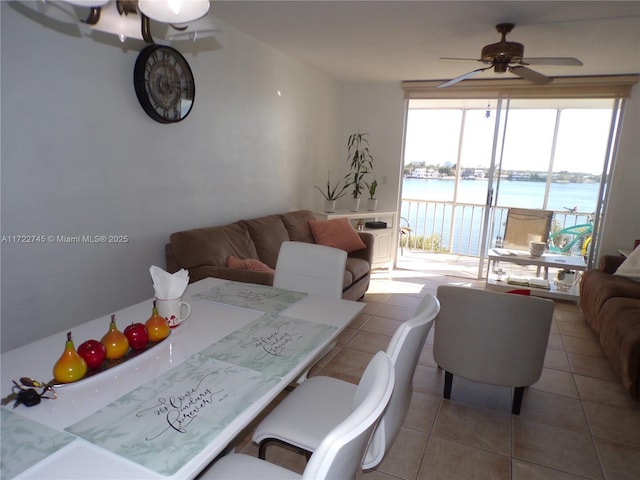 3010 Marcos Dr Unit R412, Aventura, FL 33160 - dining room featuring tile patterned flooring, a ceiling fan, and a water view