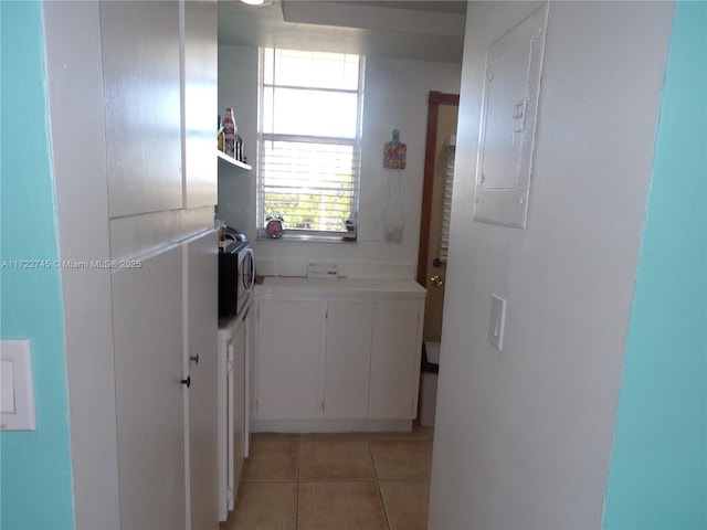 3010 Marcos Dr Unit R412, Aventura, FL 33160 - hallway with electric panel and light tile patterned floors