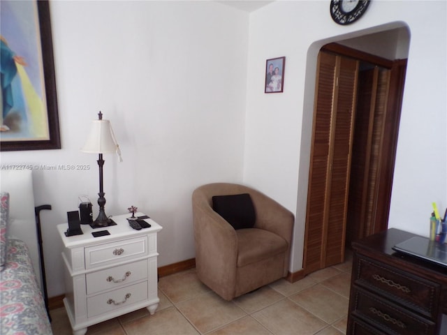 sitting room featuring light tile patterned floors