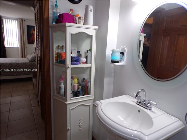 bathroom with sink and tile patterned flooring