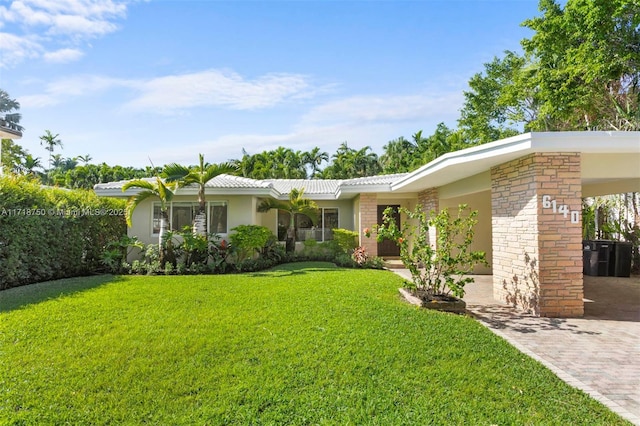 view of front facade with a carport and a front yard