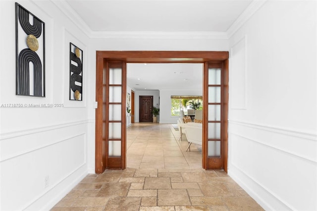 hallway featuring crown molding and french doors