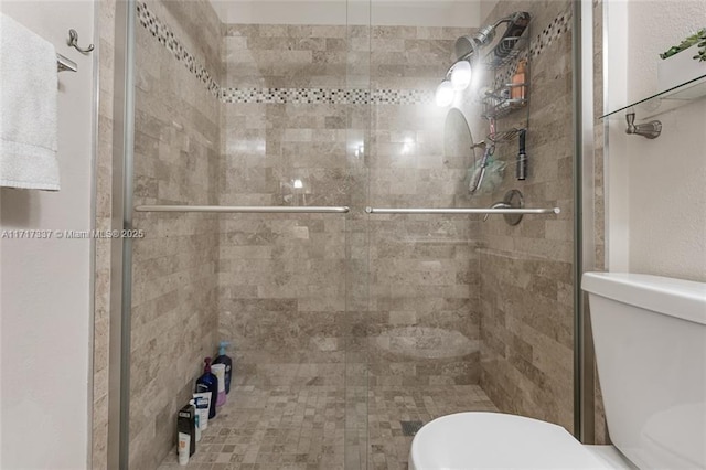 bathroom with walk in shower and toilet