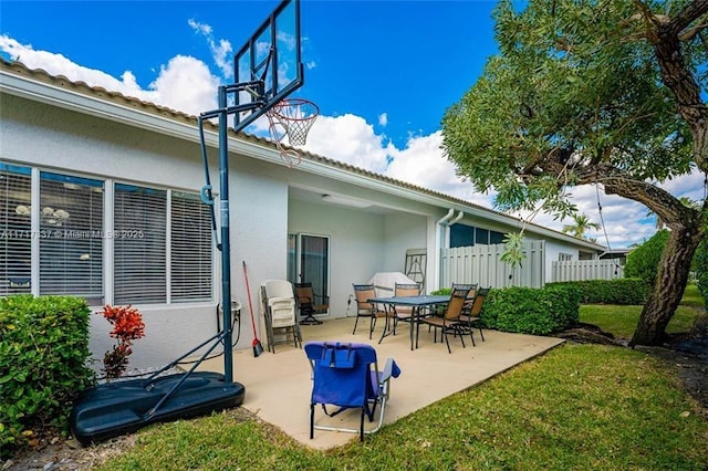 view of patio / terrace featuring fence