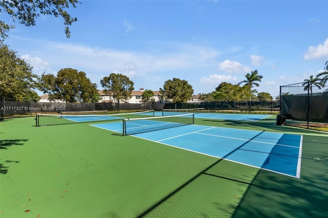 view of sport court with basketball hoop