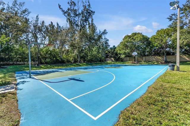 view of basketball court featuring a lawn