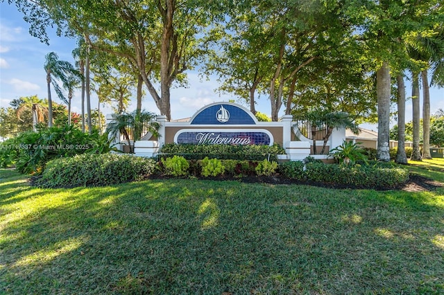 community / neighborhood sign with a lawn