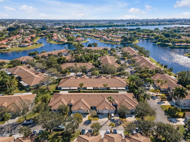 bird's eye view featuring a residential view and a water view